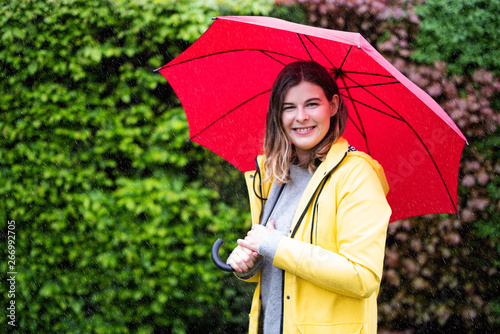 Mit Regenschirm Und Regenjacke Draussen Im Regen Buy This Stock Photo And Explore Similar Images At Adobe Stock Adobe Stock