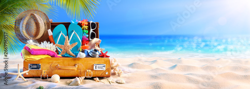 Full Suitcase With Accessories On Tropical Beach Canvas Print