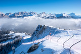 Fototapeta Góry - A ski slope above clouds, Alta Badia, Italy