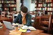 © Africa Studio - Student with laptop studying in library