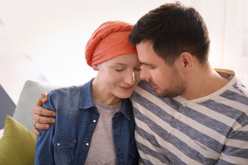 Wall Mural - Young man visiting his wife with cancer indoors