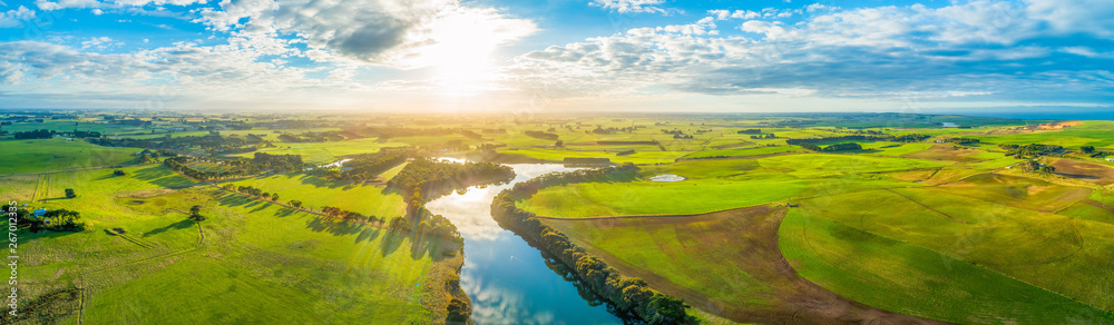Aerial panoramic landscape of scenic sunset over river and grasslands in Australia - obrazy, fototapety, plakaty 