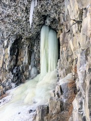 Wall Mural - Frozen Ice waterfall in mountains