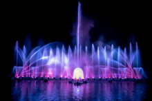 The Colorful Fountain Dancing In Celebration Festival With Dark Night Sky Background.