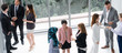 © InfiniteFlow - Many business people gathering in modern office building for business conference in the city. Businessmen and businesswomen communication and human resources concept.