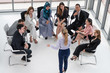 © InfiniteFlow - Businesswomen and businessmen attending group meeting conference in office room. Corporate business team concept.