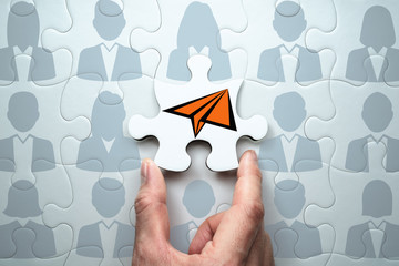 Poster - Business leadership concept. Clearly communicating vision to team.Connecting last jigsaw puzzle piece.