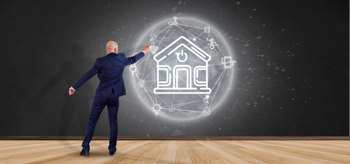 Poster - businessman in front of a wall with smart home interface with icon, stats and data 3d rendering