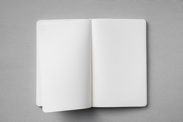 Wall Mural - white notebook with turn page on grey background