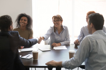 Poster - Businesspeople handshake at meeting congratulating with successful negotiations