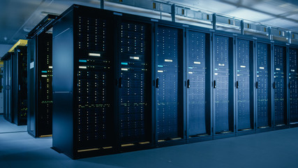 shot of data center with multiple rows of fully operational server racks. modern telecommunications,