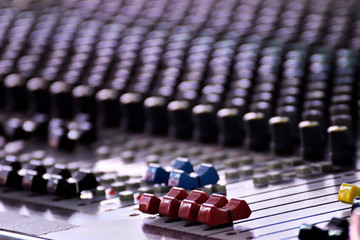 Close-up of sound mixer in a studio mixing sound.