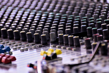 Close-up of sound mixer in a studio mixing sound.