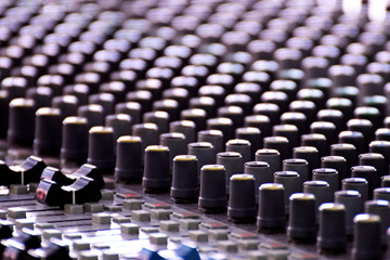 Close-up of sound mixer in a studio mixing sound.