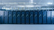 © Gorodenkoff - Shot of a Working Data Center With Rows of Rack Servers. Led Lights Blinking and Computers are Working.