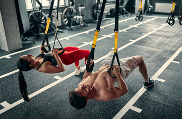 Wall Mural - Sporty couple in gym