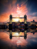 Fototapeta Fototapeta Londyn - Dreamy view to the Tower Bridge of London, UK, during sunset time with reflections in the river water of the Thames