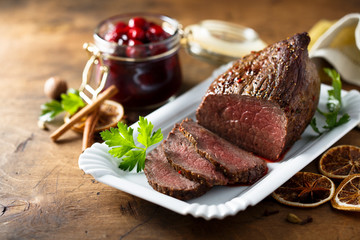 Homemade roast beef with cherry sauce