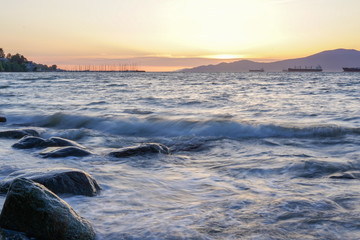 Wall Mural - sunset over waves