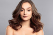 © cherry_d - Brunette girl with healthy curly hair and natural make up . Beautiful model woman with wavy hairstyle .Care and beauty
