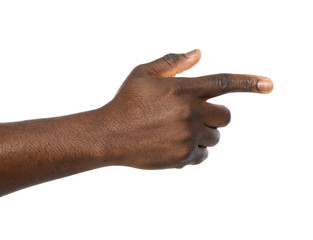 Wall Mural - African-American man pointing at something on white background, closeup