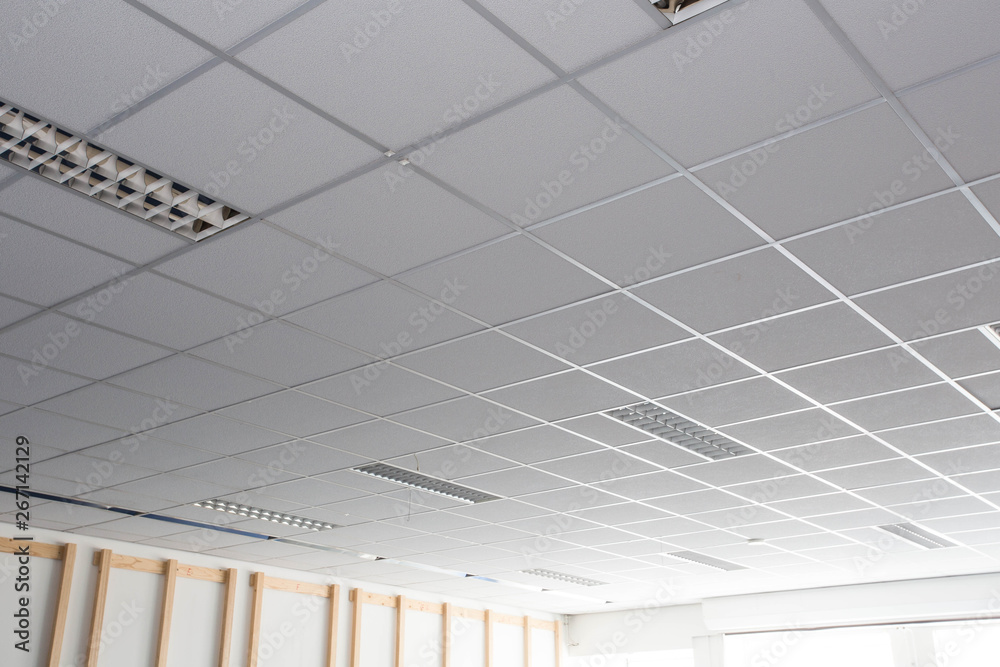 Suspended ceiling with LED square lamps sin the office - obrazy, fototapety, plakaty 