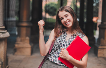 Cheerful student near the campus