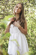 © Iveta - Young beautiful girl stay in apple blossom garden