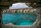 Fototapeta Do akwarium - The picturesque cave is located on the shores of the Mediterranean Sea.