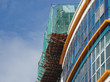 Catch platform and safety netting at the face of the building during high-rise building construction. It protects individuals and property from falling debris. 
