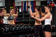 © pucko_ns - Two woman exercise with weights in gym