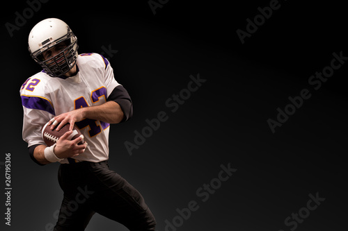 American Football Player Holding The Ball In His Hands Black Background Copy Space The Concept Of American Football Motivation Copy Space Buy This Stock Photo And Explore Similar Images At Adobe