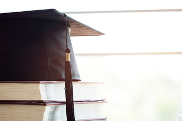 Wall Mural - education knowledge learning study abroad international ideas. graduation celebrating hat on textboo