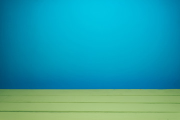Fototapete - Beautiful olive wooden table and blue wall background.