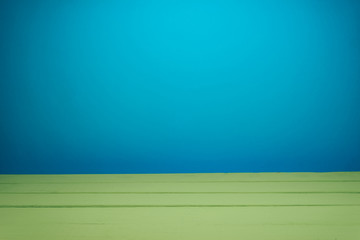Fototapete - Beautiful olive wooden table and blue wall background.