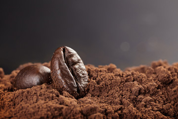 Roasted coffee bean and ground coffee. Background with copy space.