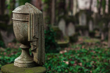 Decorative Stone Urn As A Headstone On A Cemetery - Symbol For Death, Grief, Remembrance