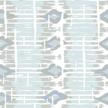Ikat pattern vector. Geometric background with ethnic rug fabric texture and chevron shapes in neutral pastel colors.