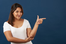 Young Woman Point Finger In Copy Space