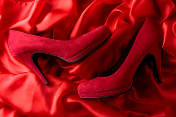Women's corduroy shoes on a silk background.