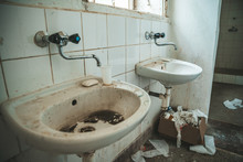 Old Dirty Toilet In Abandoned Psychiatric Hospital Building. Dirt And Disorder On Social Facilities