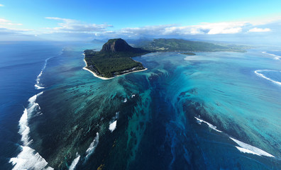 Wall Mural - aerial view of tropical island in deep blue ocean, clear water, le morne underwater waterfall at mau