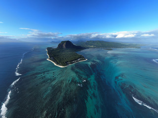 Wall Mural - aerial view of tropical island in deep blue ocean, clear water, le morne underwater waterfall at mau