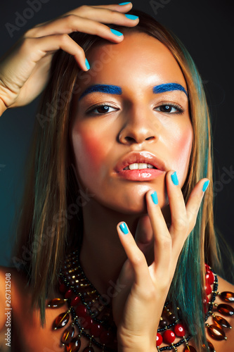 Plakat young pretty modern african american girl with bright fashion makeup and ethnic jewelry