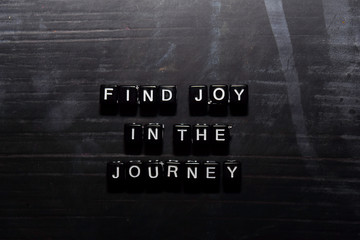 Find joy in the journey on wooden blocks. Education, Motivation and inspiration concept