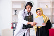 © Elnur - Female arab patient visiting male doctor