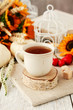 © agneskantaruk - Cup of tea and beautiful autumn floral decorations on the table.