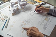 © Chaosamran_Studio - architect design working drawing sketch plans blueprints and making architectural construction model in architect studio