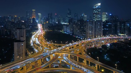 Aufkleber - Time lapse of aerial view of highway junctions shape letter x cross at night. Bridges, roads, or streets in connection or transportation concept in urban city, Shanghai Downtown, China.
