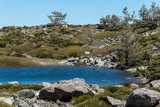 Fototapeta Do pokoju - Small glacial lake, of glacial origin, high mountain in spring. Natural Park of the Sierra de Guadarrama, Madrid, Spain